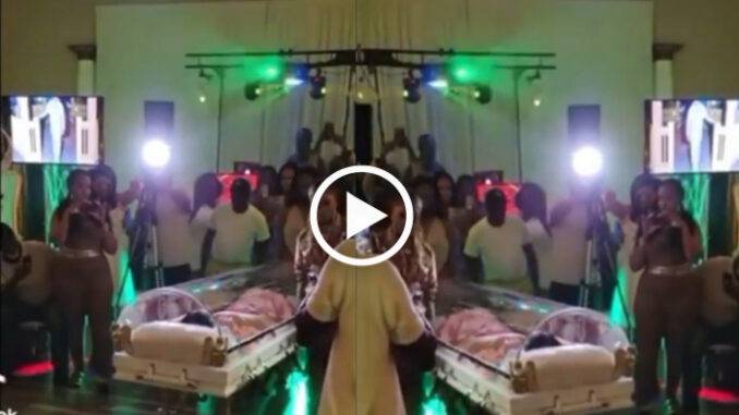 Woman happily makes entrance in a casket for her 50th birthday party