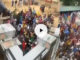 Man displays Obi Cubana, throws stacks of naira notes for large crowd (Video)